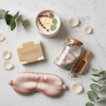 Spa Day at Home Bundle flat lay with bath salts, natural bar soap, eucalyptus lavender candle, and eye mask
